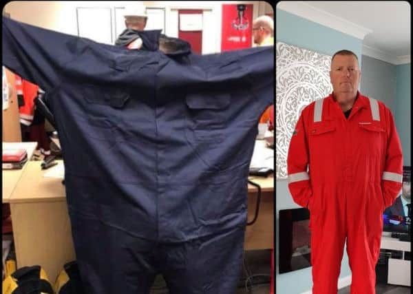 Ian Joy showing the size of his overalls before and after his weight loss.