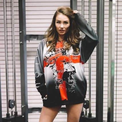 Celebrity Big Brother star Jess Impiazzi models the England MMA team kit.