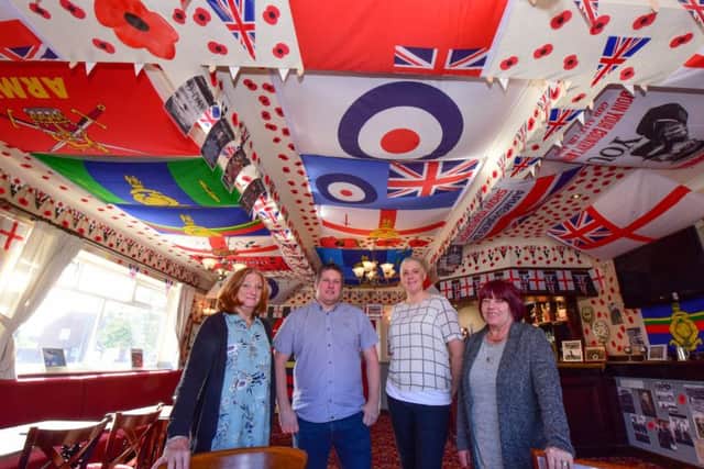 A room at the Rossmere pub, in Owton Manor Lane, Hartlepool has been covered in Army and forces flags and decorations and pictured with landlord Russ Prentice (2nd left) is wife Lorna (3rd left) with Karen Archbold (left) and Muriel Stewart (right) who helped decorate the room.