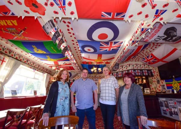 A room at the Rossmere pub, in Owton Manor Lane, Hartlepool has been covered in Army and forces flags and decorations and pictured with landlord Russ Prentice (2nd left) is wife Lorna (3rd left) with Karen Archbold (left) and Muriel Stewart (right) who helped decorate the room.