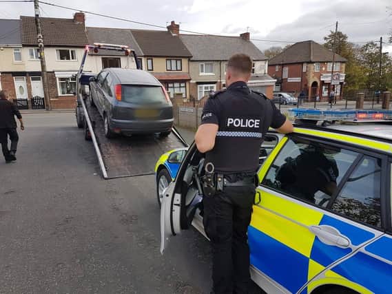 A car being seized by Peterlee police officers