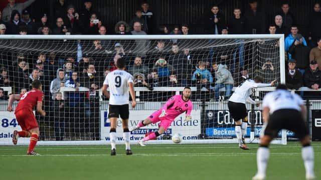 Bromley midfielder Frankie Sutherland scores a second penalty beating Hartlepool goalkeeper Scott Loach.
