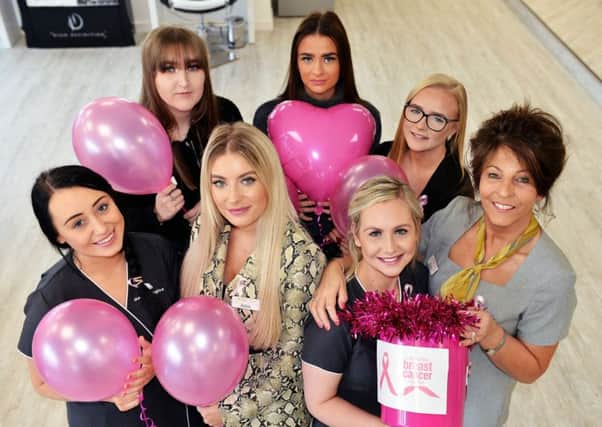 Ladies Room staff Abbie Smith, Michaela Porritt, Beth Forcer, Lauren Morton, Karen west, Amy Wallace and Siobhan Lister at the launch of the Ladies Room fashion and beauty show in aid of Breast Cancer Care.