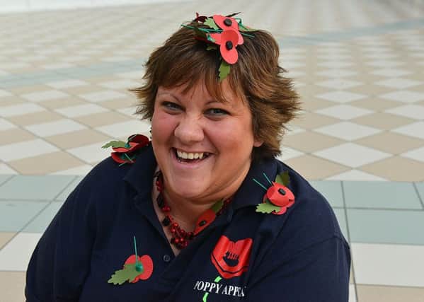 Sian Cameron with Poppies in Middleton Grange Shopping Centre.