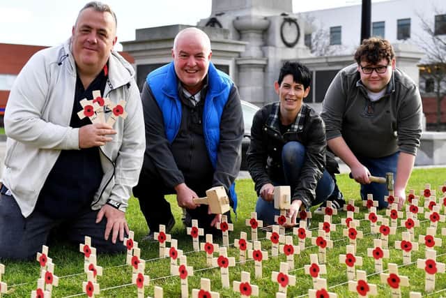 (Left to right) Ian Crawley, Dave Hunter, Jamie Horton and Anth Frain give a helping hand at the Poppy Crosses event at Victory Square.