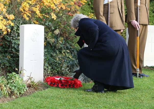 Prime Minister Theresa May at the St Symphorien Military Cemetery in Mons, with Belgian Prime Minister Charles Michel, laying a wreath at the grave of George Ellison, the last British soldier to be killed before Armistice in 1918.