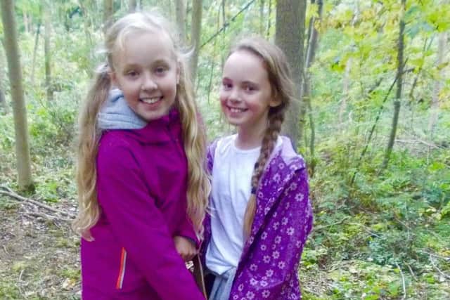 Pupils Emilia (left) and Lilly (right) enjoying their work in Wynyard Woodland Park