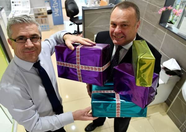 Lee Dees (left) and Michael Sumpter from MKM launch the 2018 Hartlepool Mail Give a Gift appeal. Picture by FRANK REID