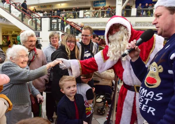 Santa Claus's arrival at Middleton Grange shopping centre last year .