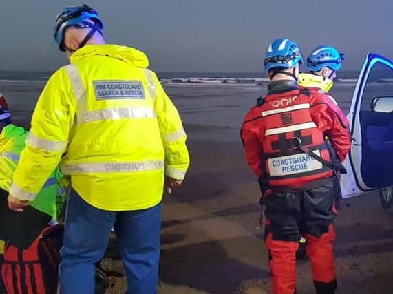 Coastguard Rescue Team members on the scene.
