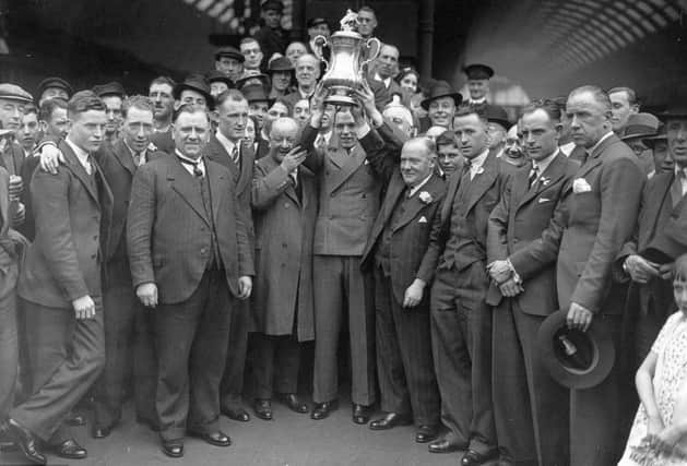 The Sunderland team arrive back on Wearside with the FA Cup in 1937.