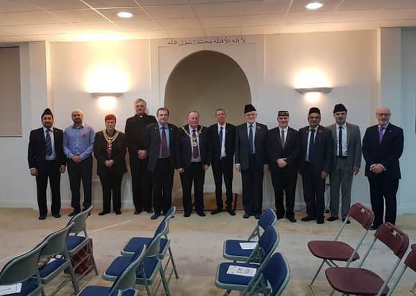From left: Farhan Ali, Dr Bilal Tahir, Mayor of Darlington Councillor Veronica Copeland, Father Graeme Buttery of St Oswald's Church, Barry Coppinger,  Councillor Allan Barclay, Mike Hill MP, Bilal Atkinson, Tahir Selby, Dr Irfan Malik, Syed Hashim Ahmad and Brigadier PJA Baker OBE.