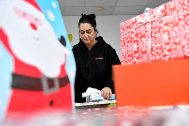 Gemma works on one of the shoeboxes for the Foundation's Christmas appeal.