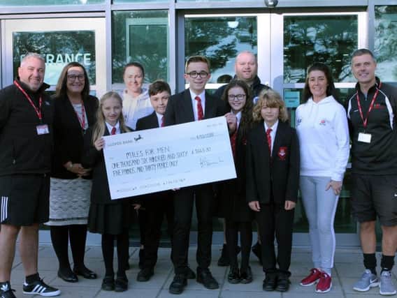 Delighted staff and pupils with Miles for men founder Michael Day.