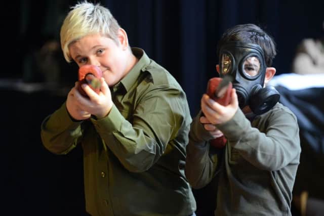 High Tunstall College of Science students take aim for a scene from their production of War Horse