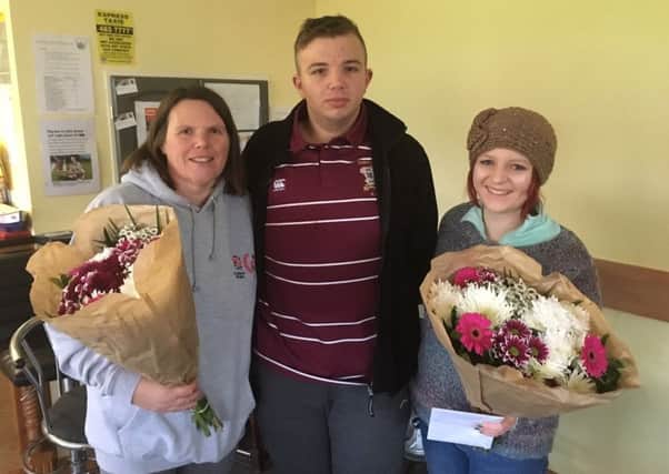 Jarrovians Colts team manager Suzanne Etchells and first aider Eleanor Peggie with rugby player Karl Mann after the accident.