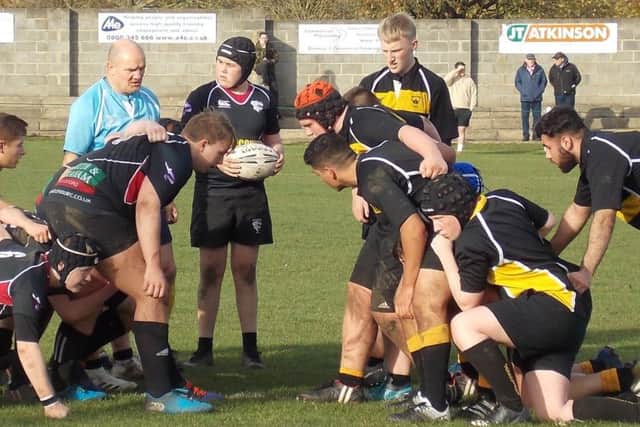 Hartlepool RFC U-17s player Karl Mann, in front of referee, during the game.