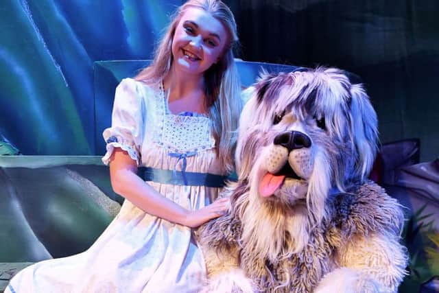 Mollie Shellard (Wendy) with her dog played by Julian Riley in Peter Pan at the Forum Theatre.
