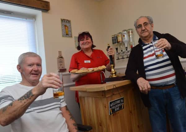 Field View Care Home opens its new bar, The Field View Arms.
Residents from left Jim Brown and Stan Spowart with deputy manager Karen Collins