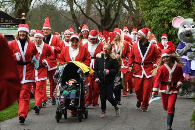 People taking part in this year's Hartlepool Santa Run at Ward Jackson Park.