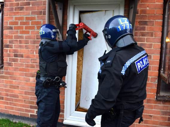 Police carrying out raids at Wynyard Mews.