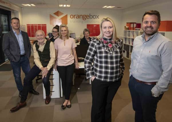 Sarah Thorpe, Area Manager, UK Steel Enterprise with Director Simon Corbett and members of the Orangebox Training team.
