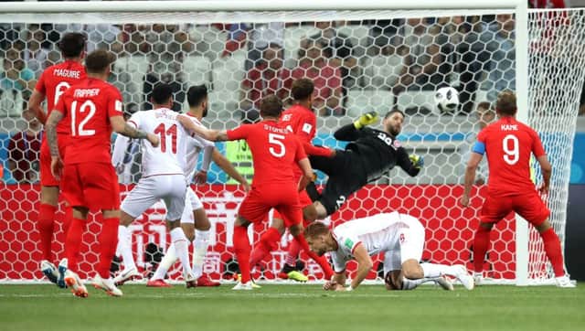 England's Harry Kane (right) scores his side's first goal of the game during the FIFA World Cup Group G match at The Volgograd Arena, Volgograd. Picture: Adam Davy/PA Wire.