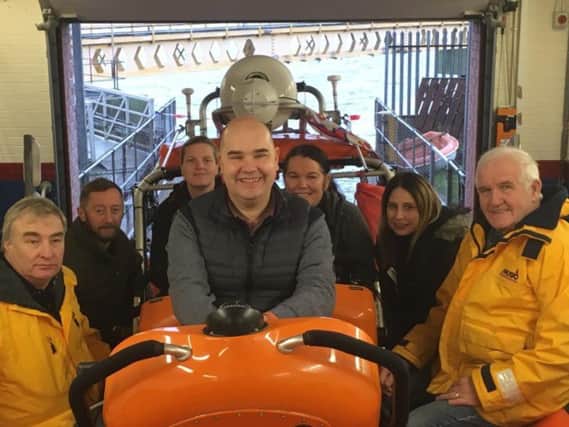 Hartlepool RNLI crewmember Mark Barker (left) and Hartlepool RNLI fundraising co-ordinator Tommy Price(right) with McColl's Area Manager Michael Johnson(centre) and his colleagues John Ward, Jodie Maskell, Carly Horsley and Gail Farrington. Picture Tom Collins/RNLI.
