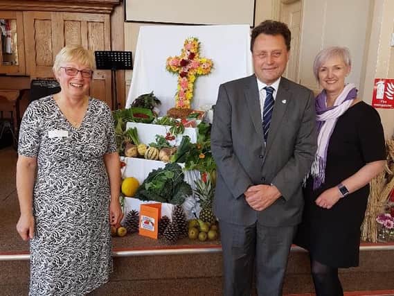 From left, The Reverend Cath Thompson, of the Church of the Nazarene, who led the service which was hosted by Headland Baptist Church, Councillor Stephen Thomas, Chair of Hartlepool Borough Councils Adult and Community Based Services Committee, and Caroline Ryder-Jones, from Dementia-Friendly Hartlepool, at a Dementia Friendly Harvest Festival.