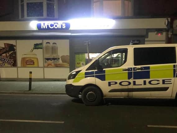 Police outside the McColl's shop targeted by robbers.