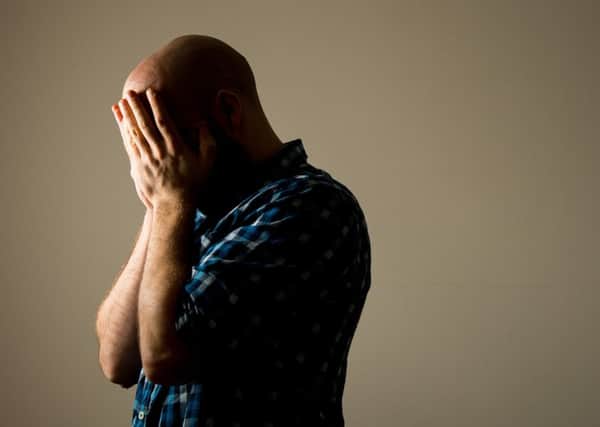 A man showing signs of depression (picture posed by model). Picture by PA Archive/PA Images