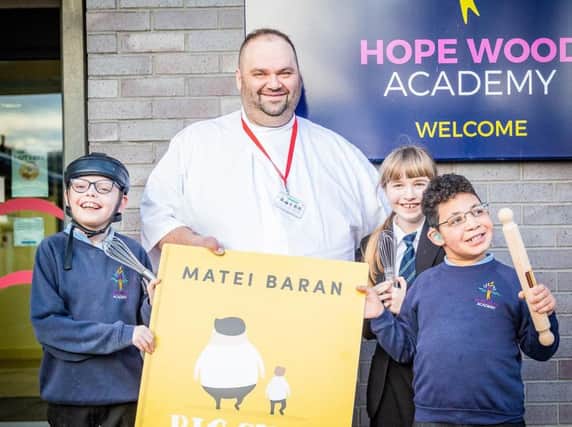 MasterChef quarter finalist Matei Baran with pupils from Hope Wood Academy.