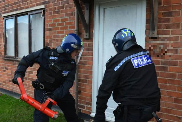 Police raid a house as part of Operation Otley in Hartlepool.
