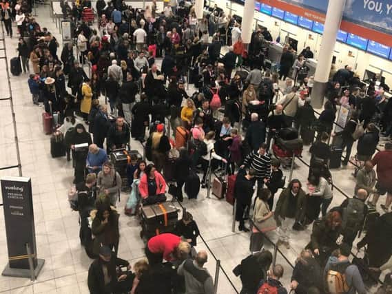 Queues at Gatwick Airport check-in. Picture by PA