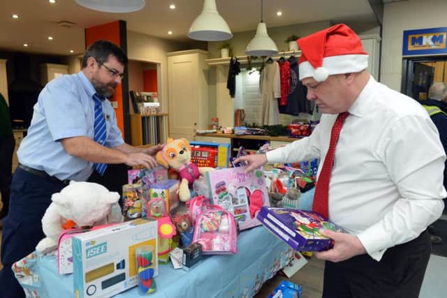 Hartlepool, Mail Christmas Toy Appeal at MKM Building Supplies. Director Mick Sumpter (R)