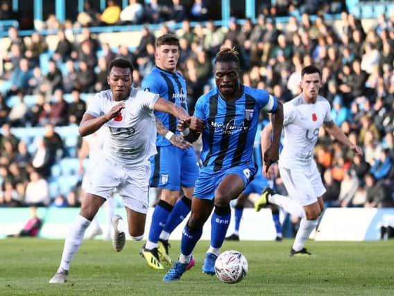 Marcus Dinanga in action against Gillingham in the FA Cup earlier this season.
