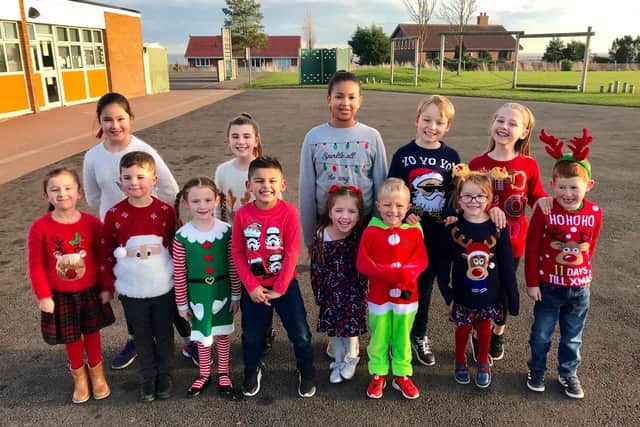 Pupils from Clavering Primary School in their Christmas jumpers.