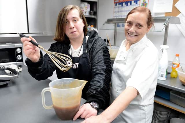 Rosie Charlton (left) with volunteer Chef Trish Carr as he part in the cookery workshop held at Cafe 177. Picture by FRANK REID