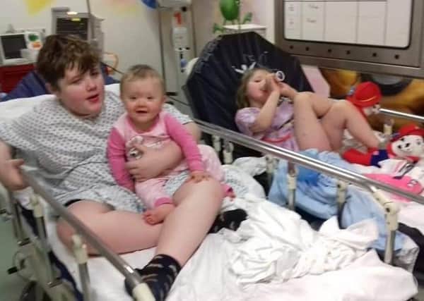 Eliza, eight months, Emily, four, and Dylan, 10, all Littlewood, in hospital following the fire at their home.