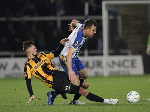 Hartlepool United's Carl Magnay battles for the ball.