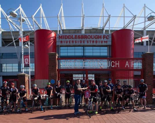 Marc Hall (right) and the other cyclists at Middlesbrough's Riverside Stadium in 2018's sponsored bike ride. Photo by Andrew Gill.