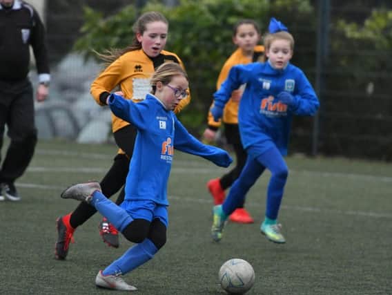 Hartlepool Pools Youth u9s,in blue, take on Norton & Stockton Girls u9s, in yellow, at Peterlee's East Durham College.