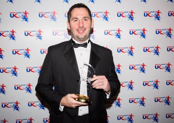 Martin Boatman receives the Performance Development of the Year Award at the UK Coaching Awards in 2016.