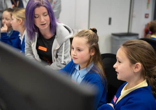 Primary girls learning from leading women in technology.