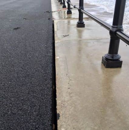 The gap between the coping stones and the promenade surface.