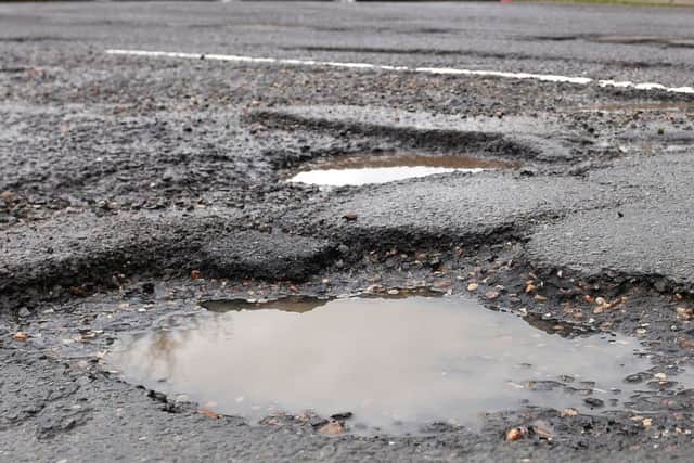 A pothole in a road. Pic by PA.