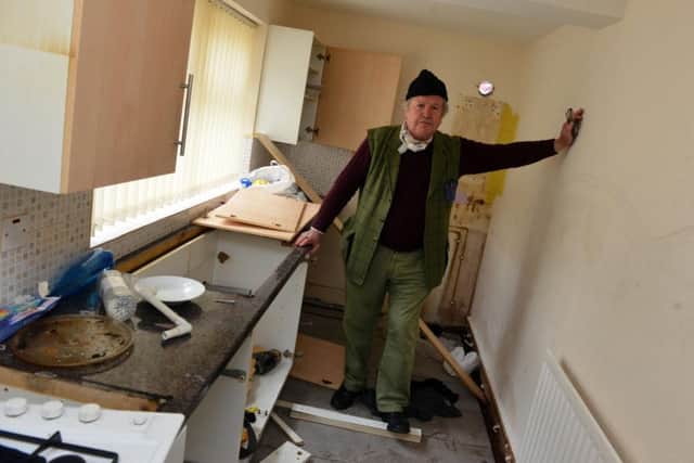 Landlord Charles Scott surveys the damage after the third break-in of the property in Devon Street, Hartlepool.