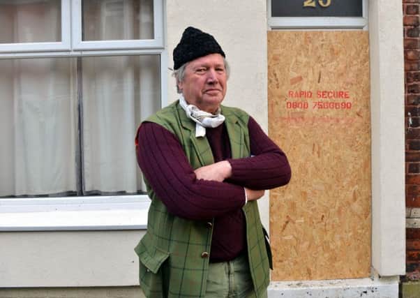 Devon Street landlord Charles Scott is unhappy over the condition of the street and repeated house burglaries.