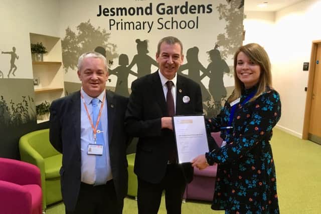 From left: Peter Ingham Jesmond Gardens Chair of Governors, Mike Hill MP and parent support advisor Carly Lupton receiving the school's Leading Parent Partnership Award.