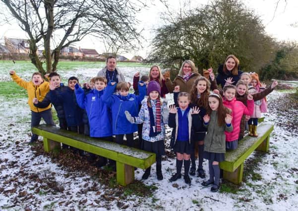 The Friends of West Park Primary School, Hartlepool, have won £10,000 funding from Aviva to improve outdoor learning space. The group are pictured celebrating with pupils in an area that  will benefit from the funding.